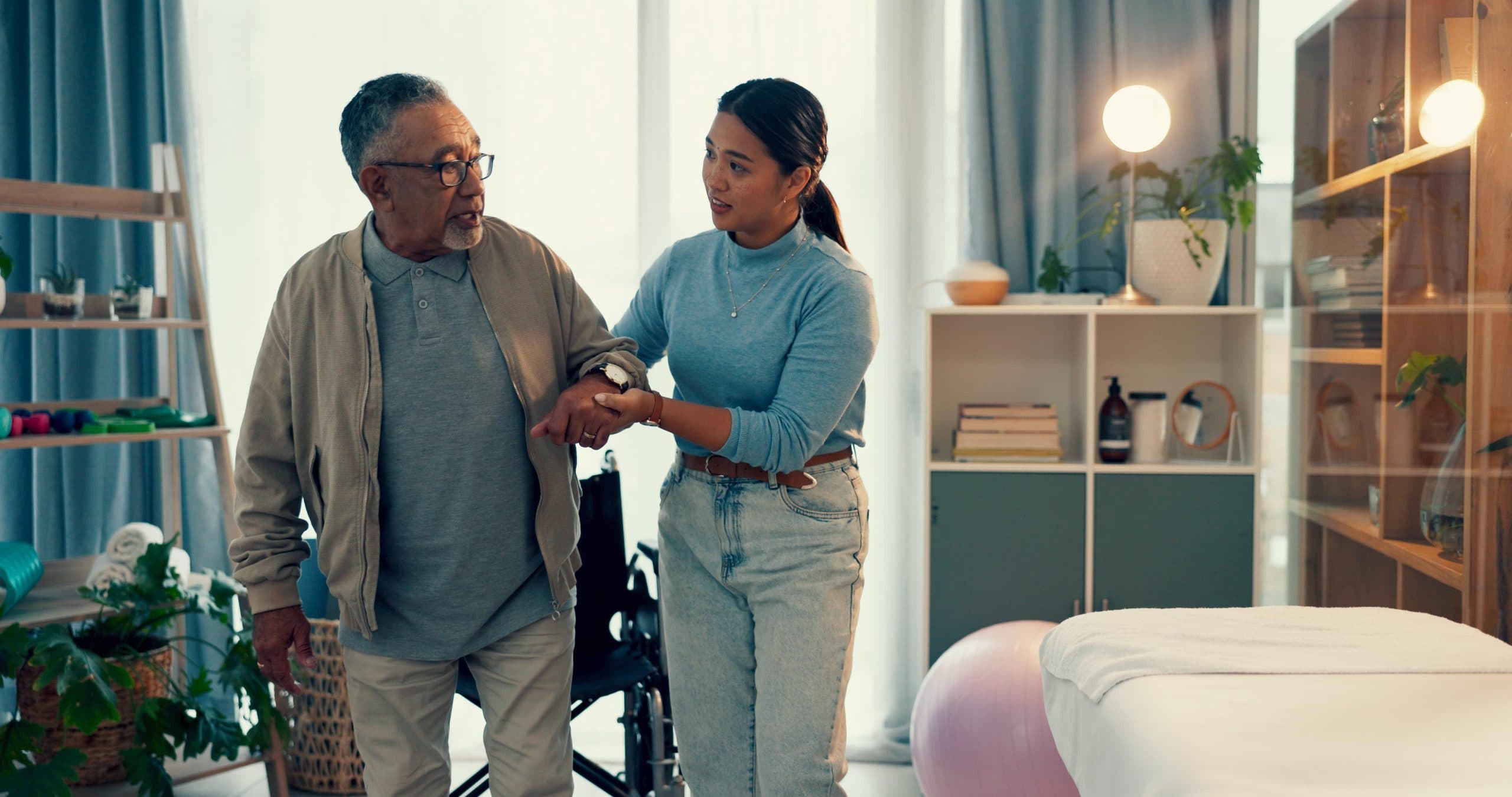 Caregiver assisting a patient indoors